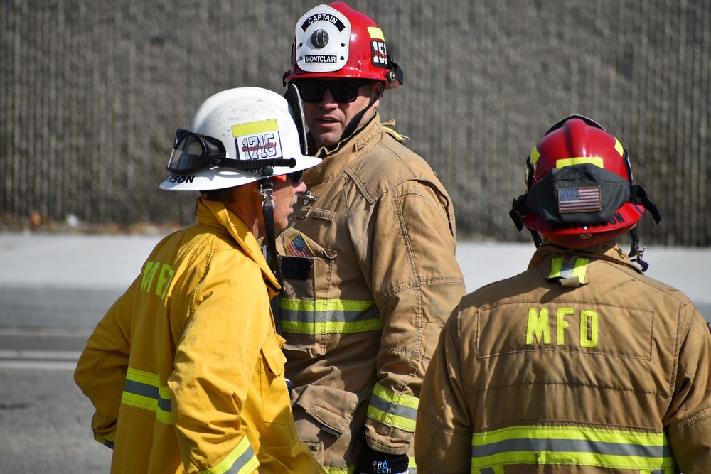A team of firefighters talking together on duty