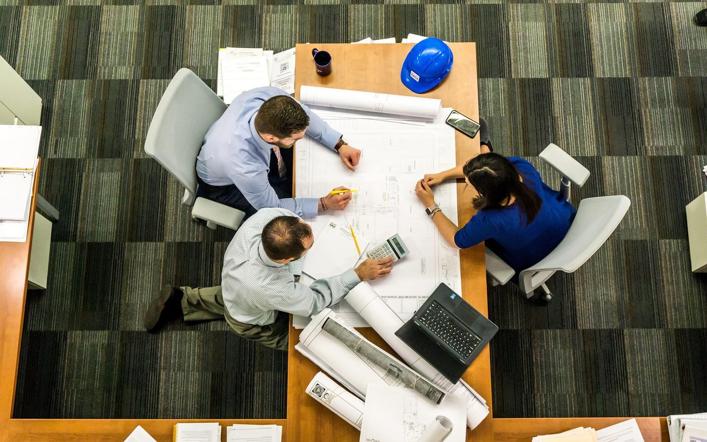 A team planning a project together around a conference table